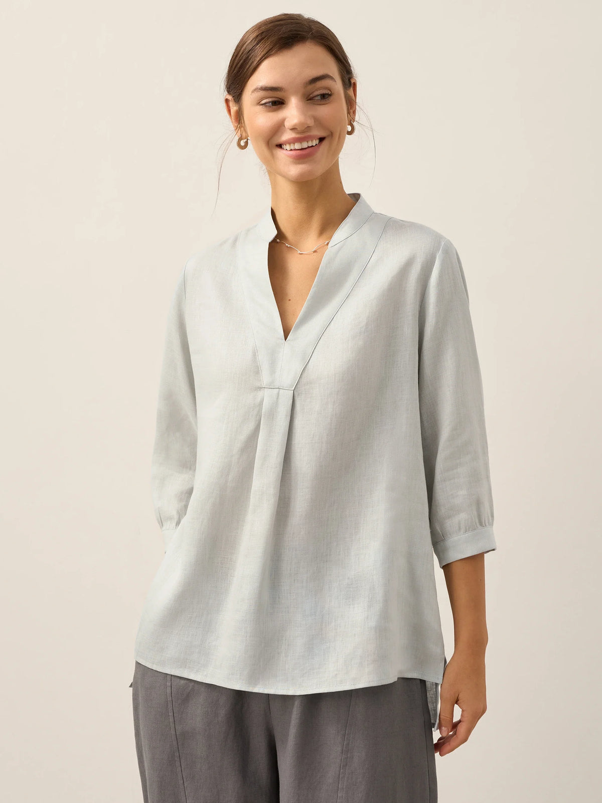 a woman smiling at camera