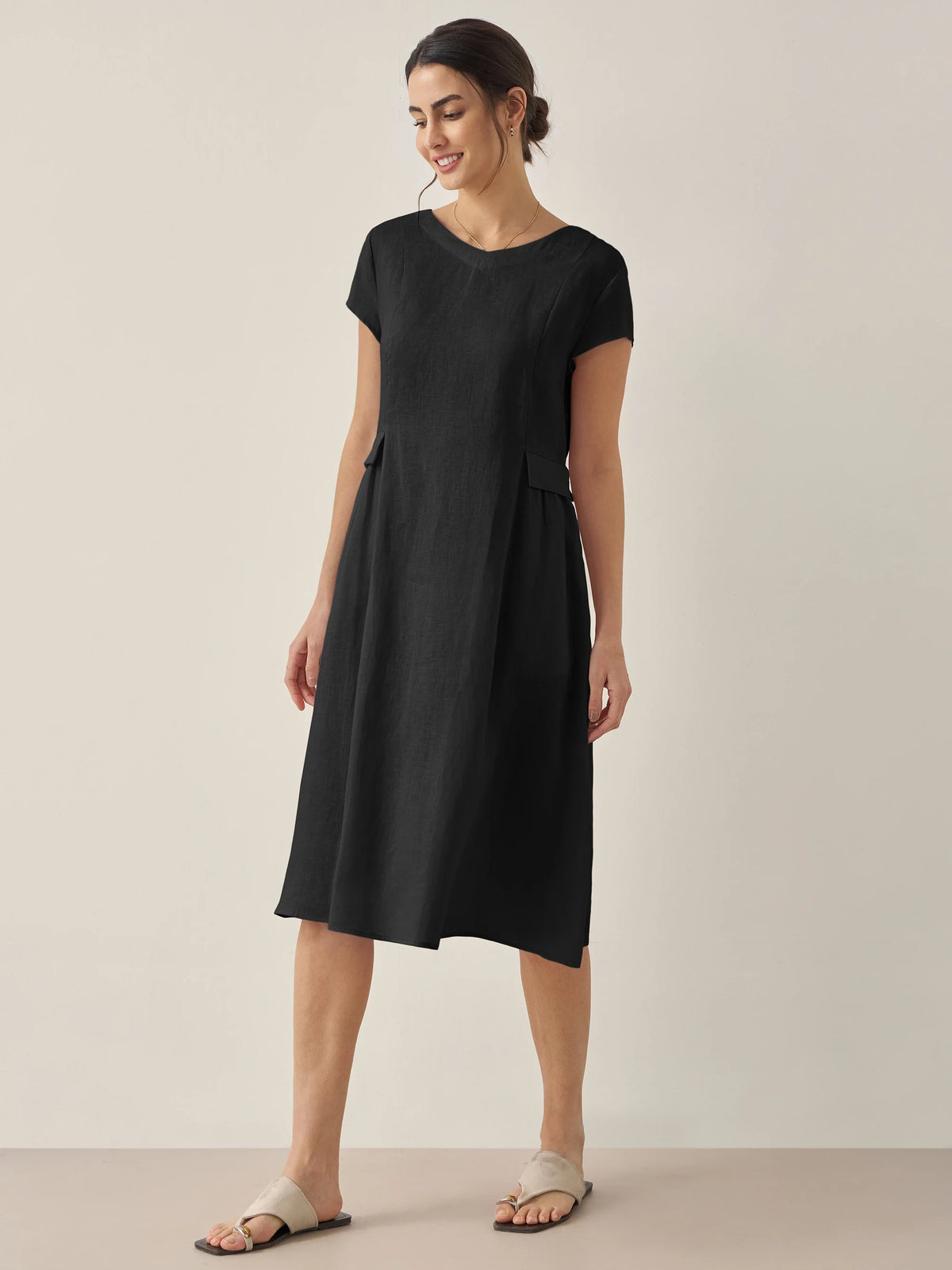 a woman in a black dress