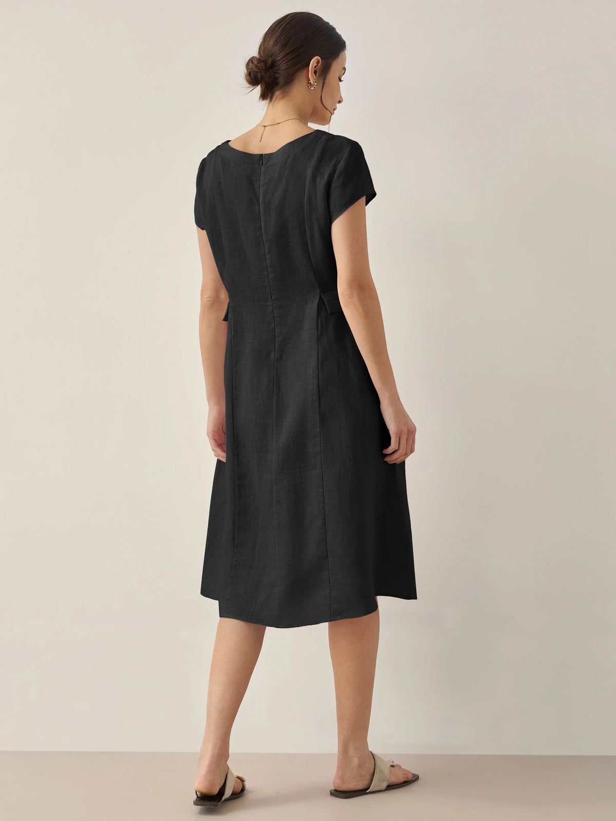 a woman in a black dress