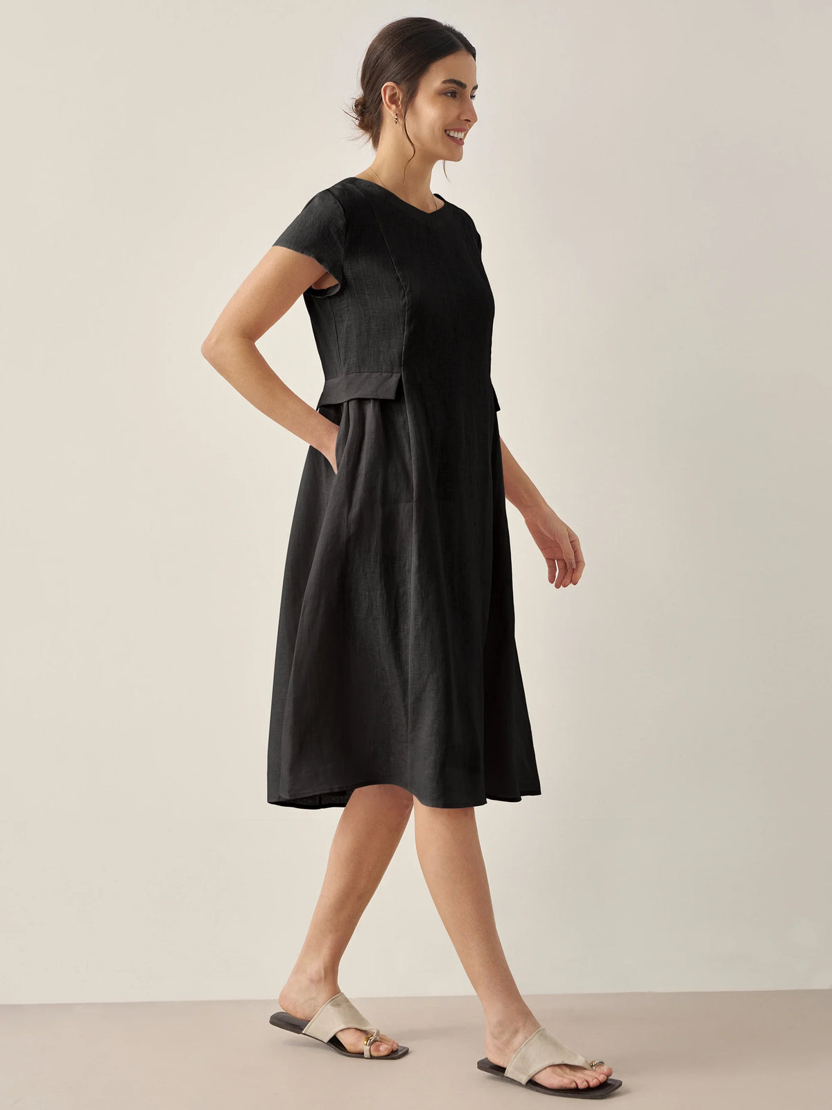 a woman in a black dress