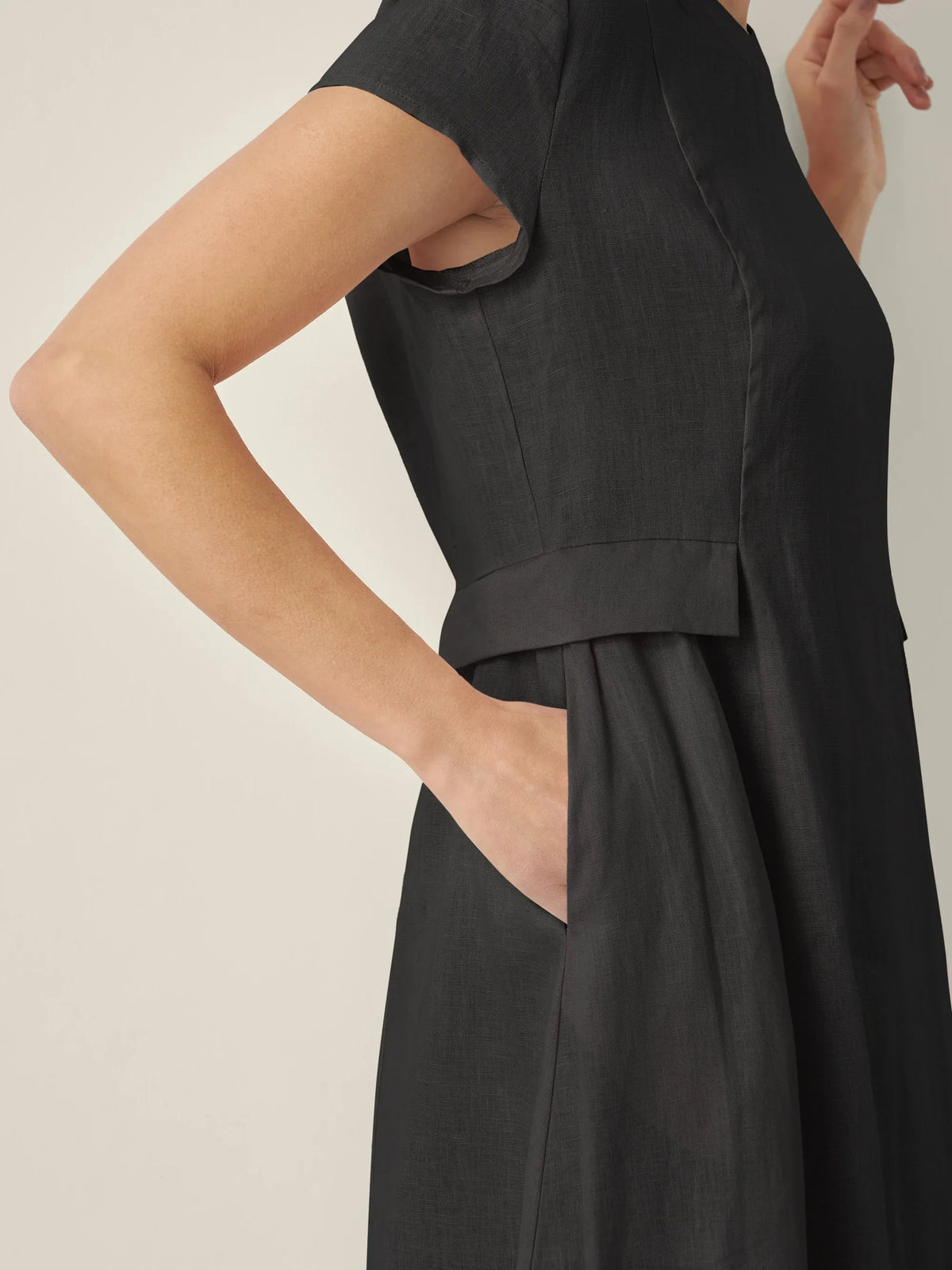 a woman wearing a black dress