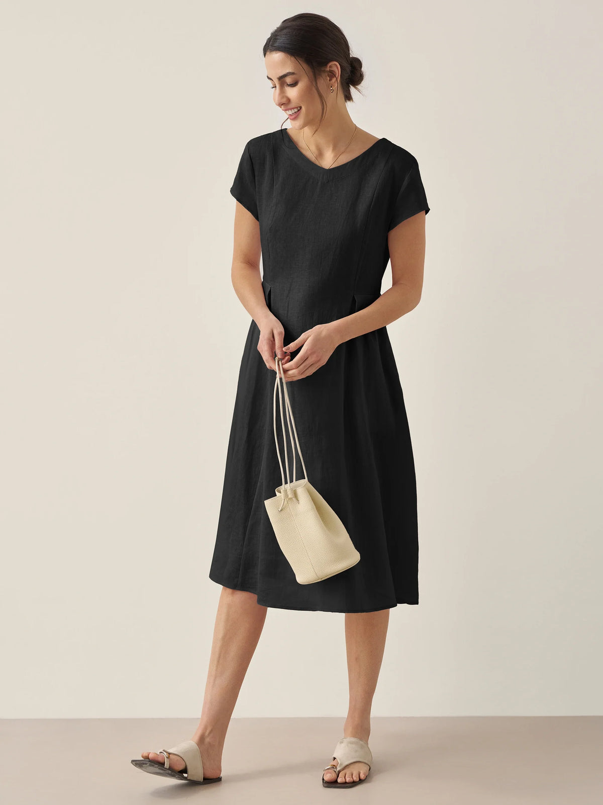 a woman in a black dress