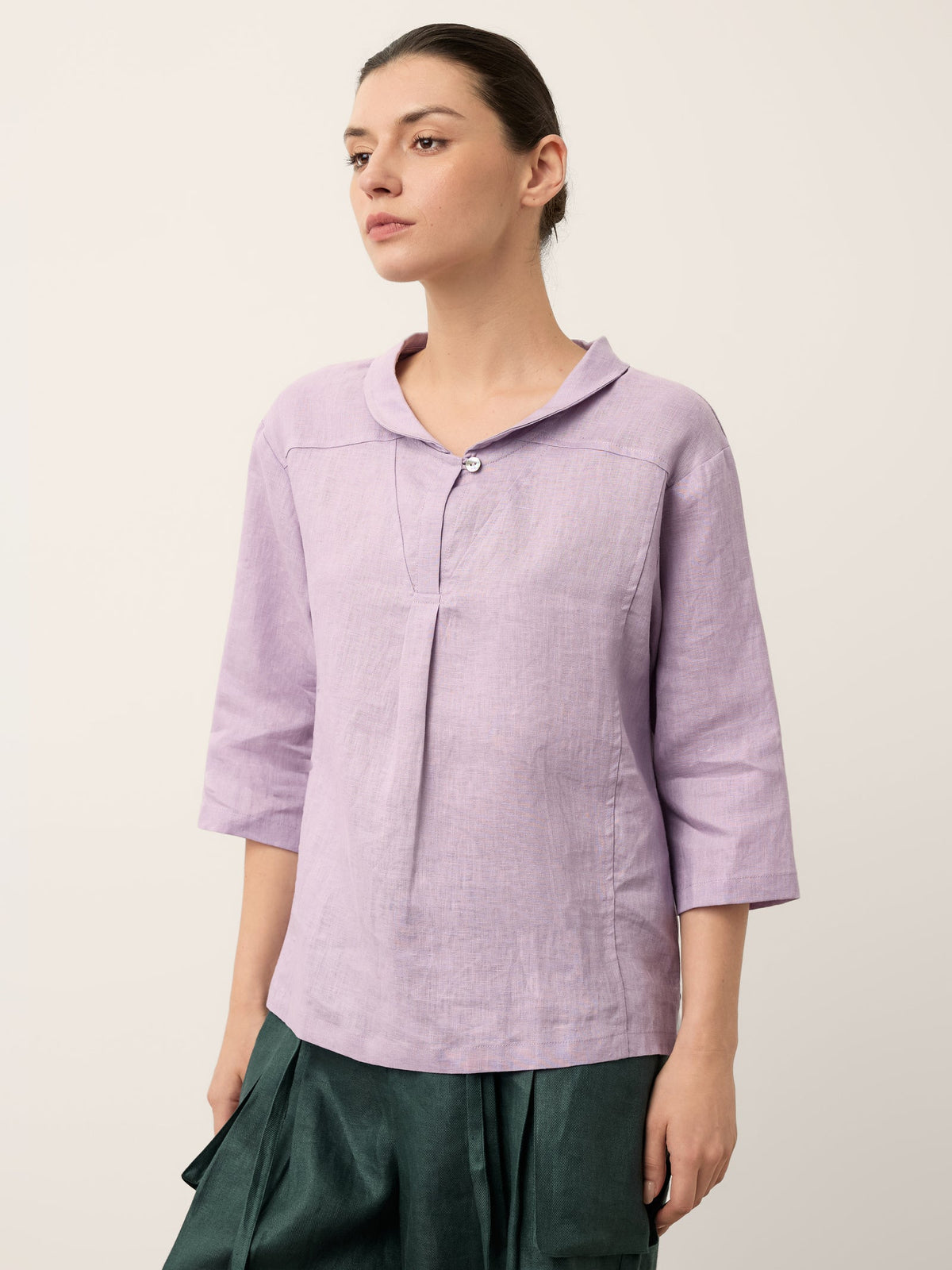 a woman in a purple shirt