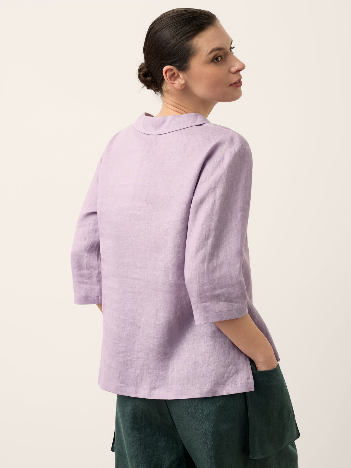 a woman in a purple shirt