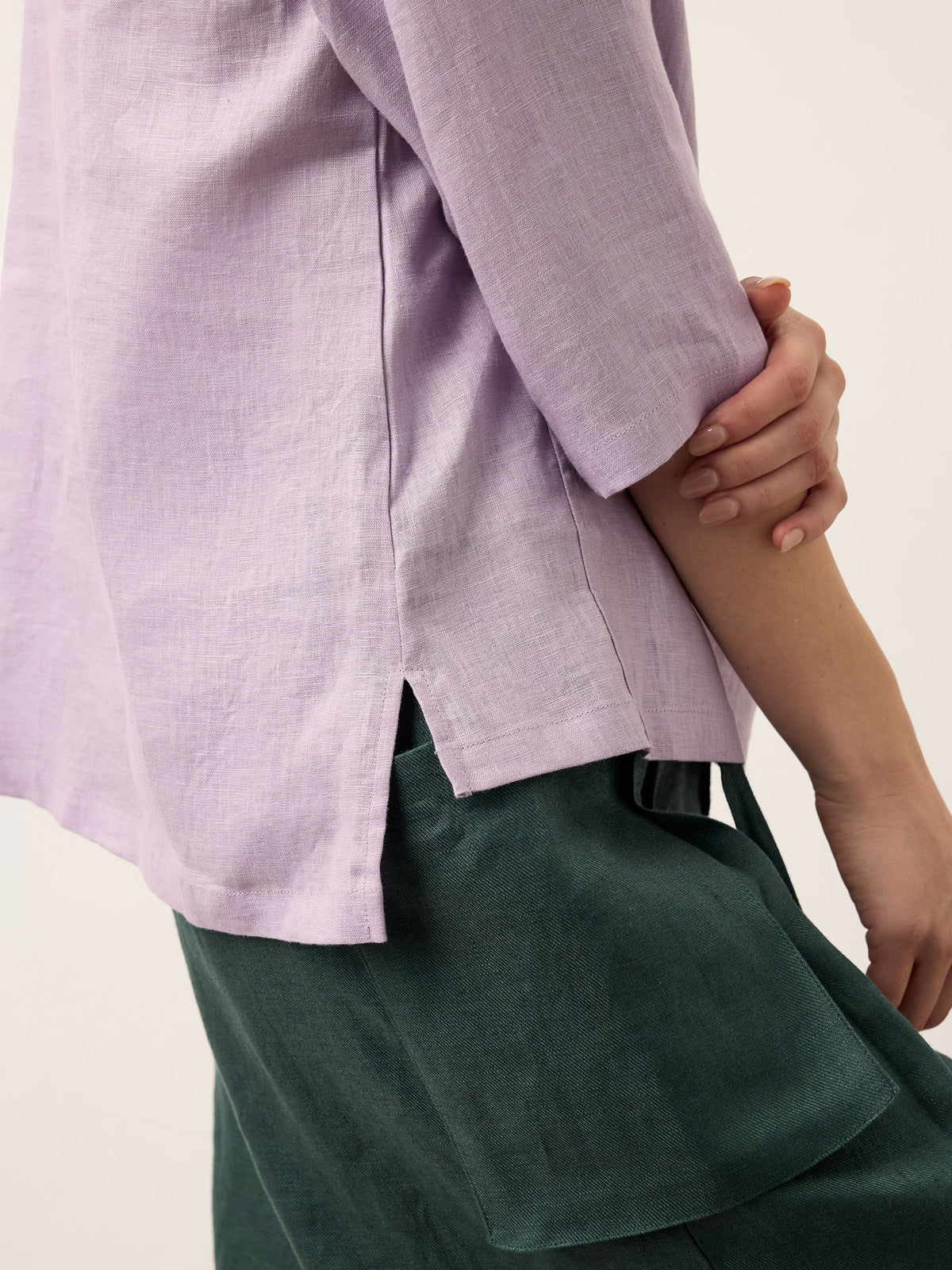 a person's back with a purple shirt