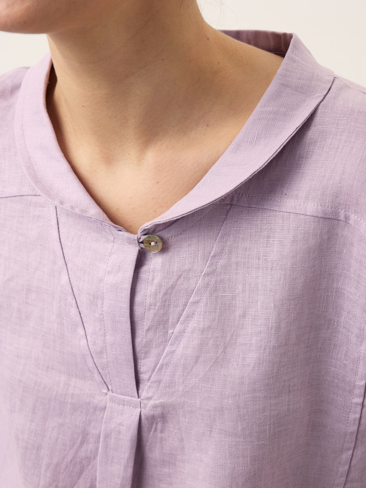 a person wearing a purple shirt