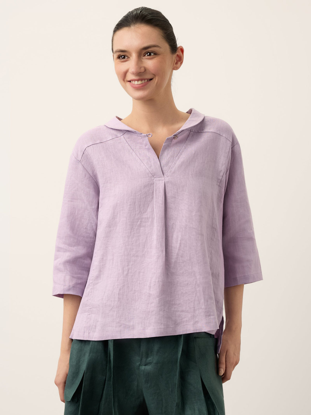 a woman smiling at the camera