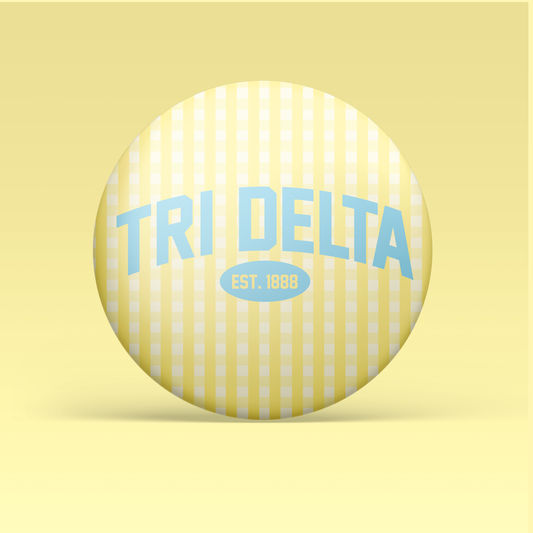 a yellow and white striped button with blue text