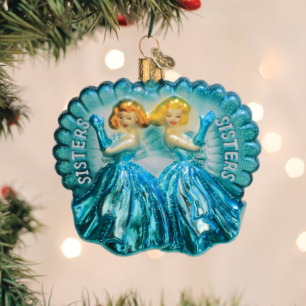 a blue ornament on a christmas tree