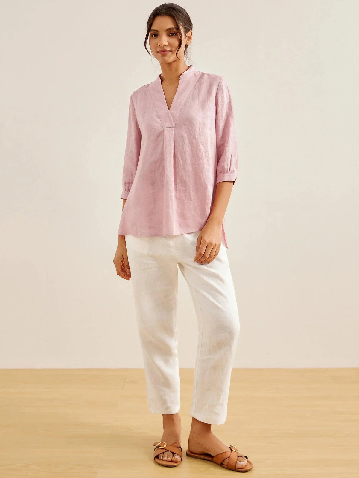 a woman in a pink shirt