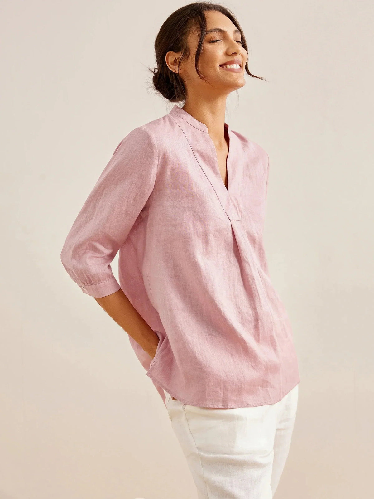 a woman in a pink shirt