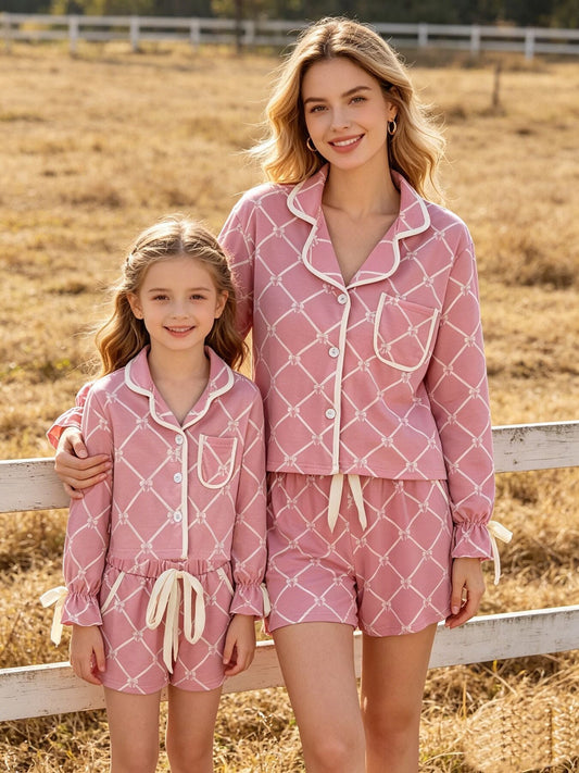 a woman and a girl wearing pajamas