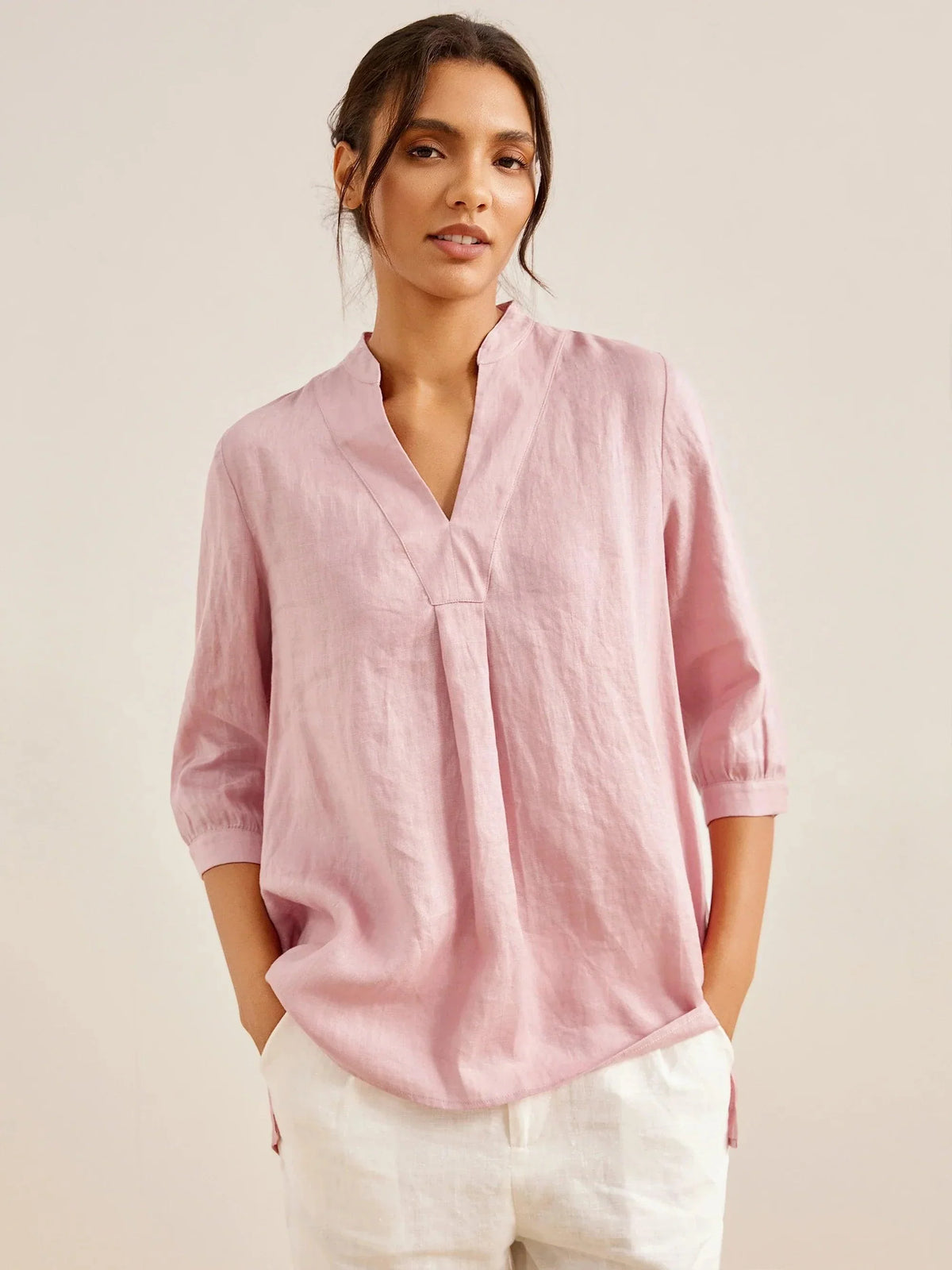 a woman in a pink shirt