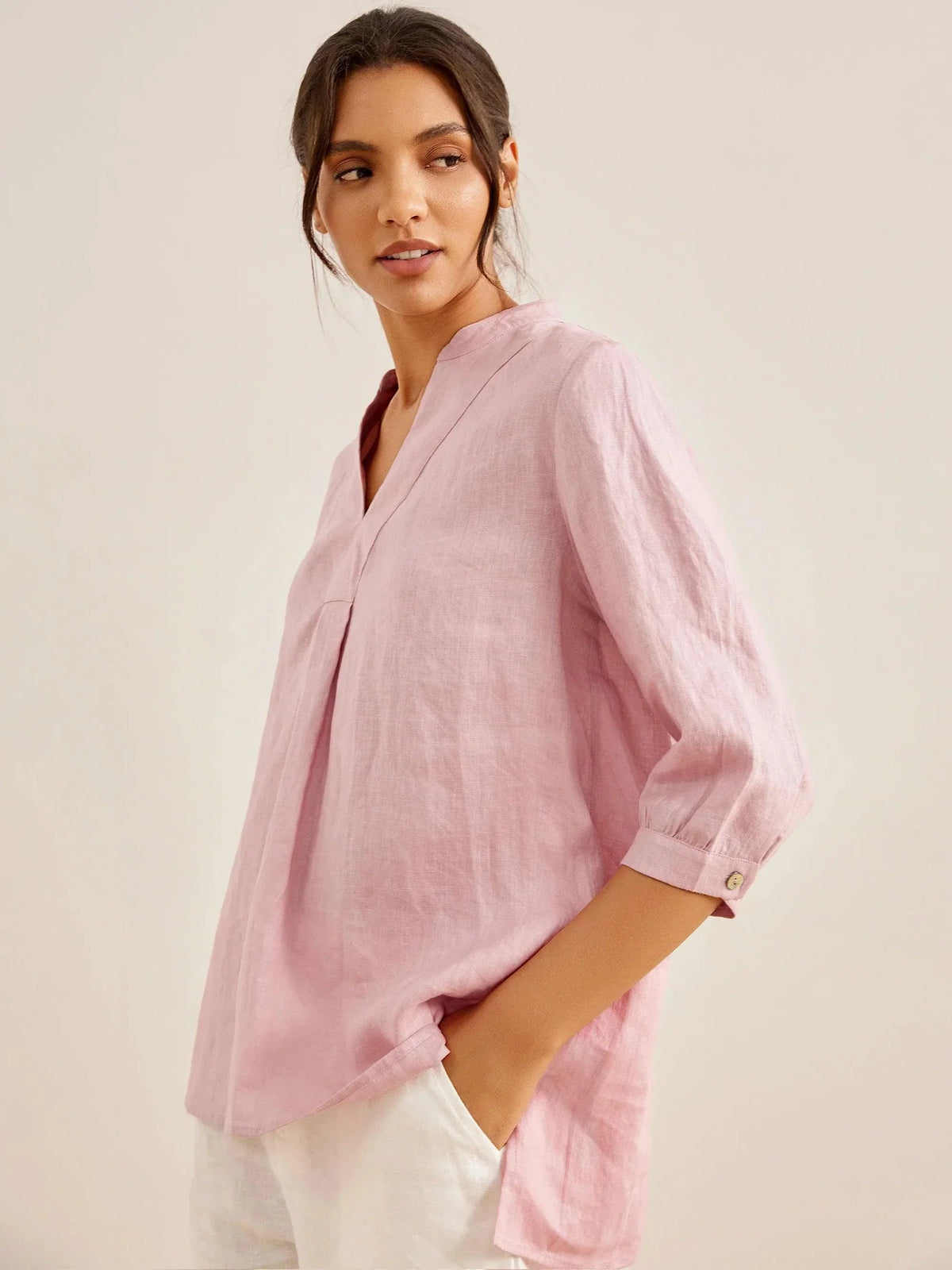 a woman in a pink shirt