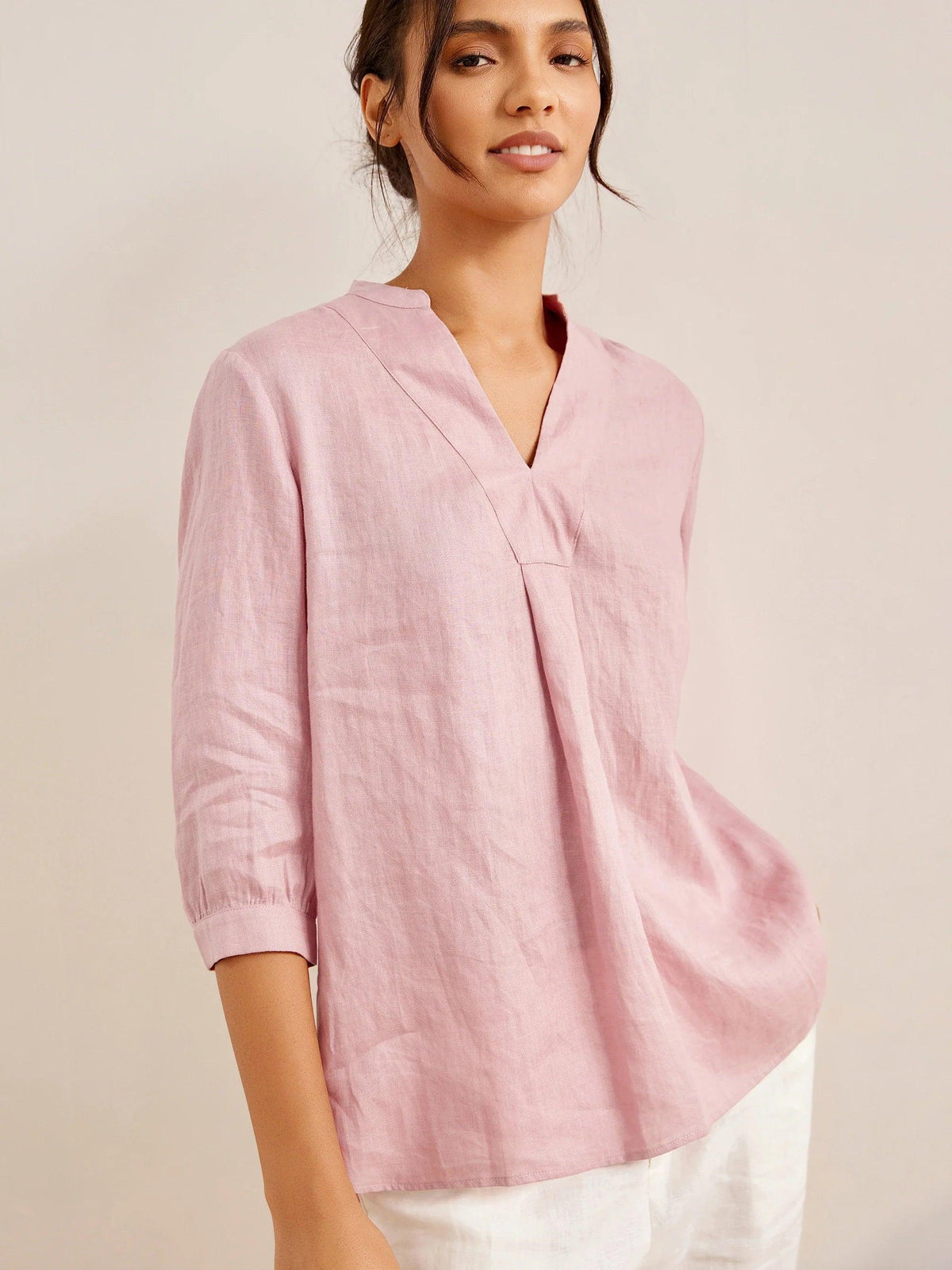 a woman in a pink shirt