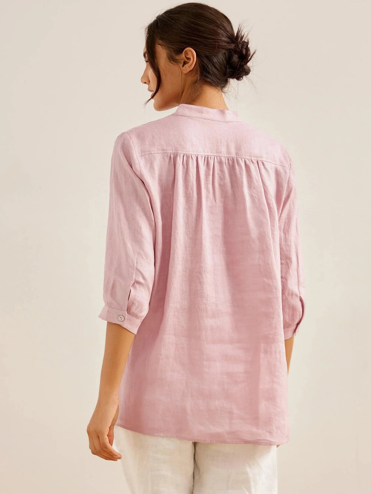 a woman in a pink shirt