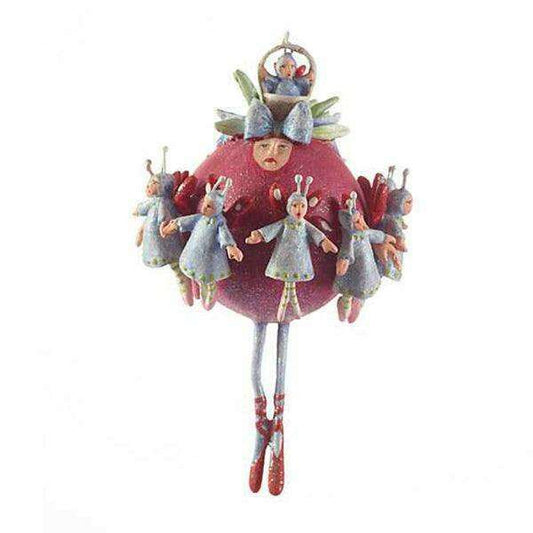 a red and pink ornament with small dolls