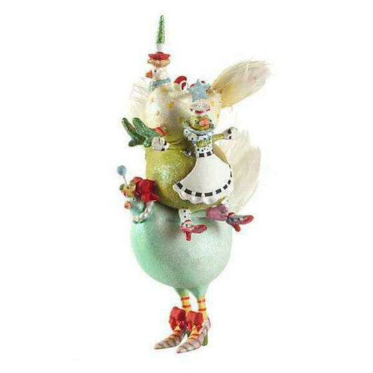 a statue of a chicken on top of a ball