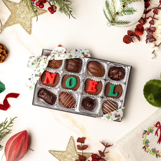 a box of chocolates with letters and decorations