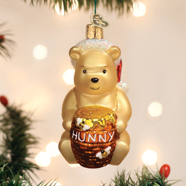 a gold bear ornament from a tree