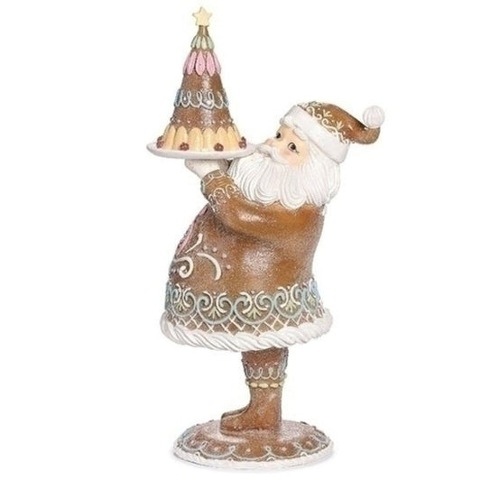 a statue of a santa holding a cake