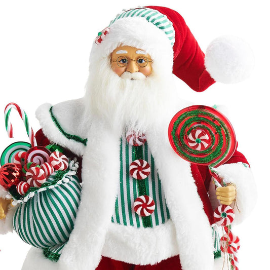a santa claus holding candy