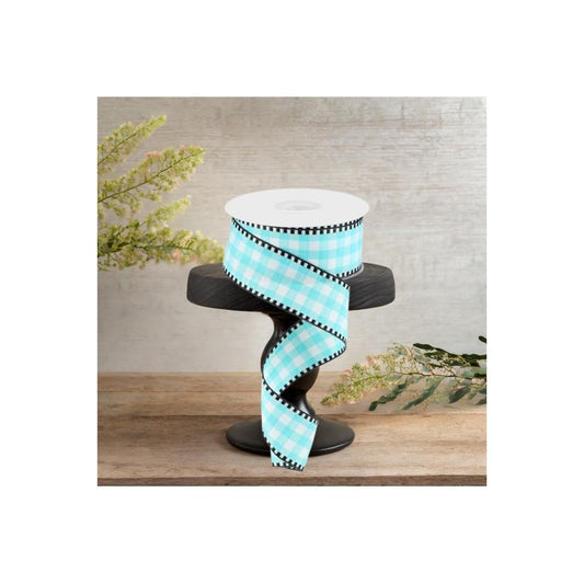 a blue and white ribbon on a black stand