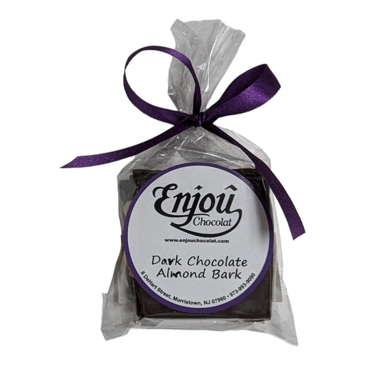 a chocolate bar in a plastic bag with a purple ribbon