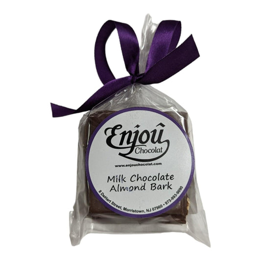 a chocolate bar in a plastic bag with a purple ribbon
