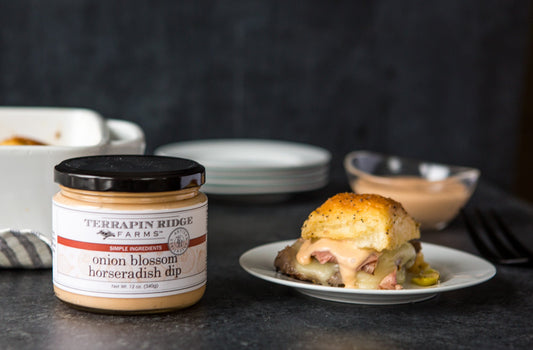a plate of food and a jar of sauce