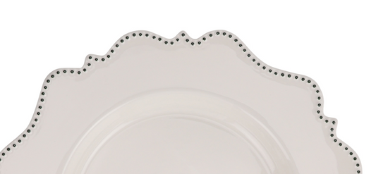 a white plate with black dots