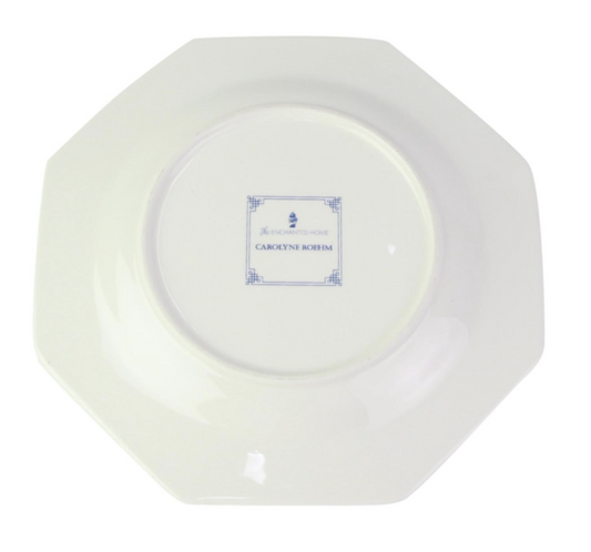 a white plate with blue writing on it