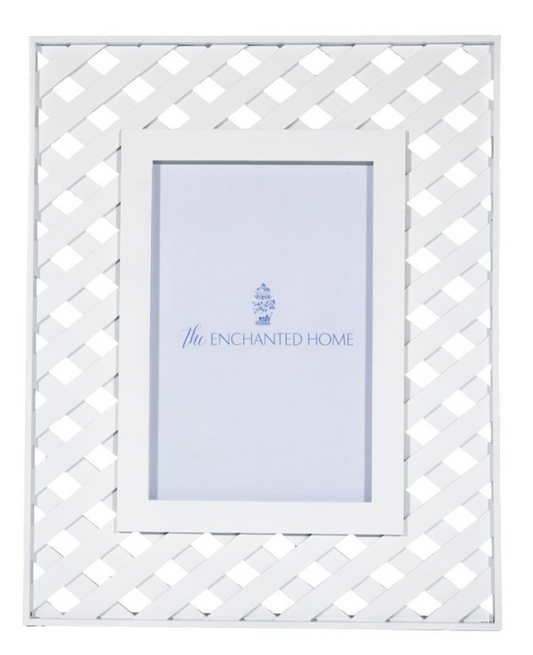a white picture frame on a white surface