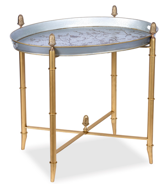 a round metal tray on a gold stand