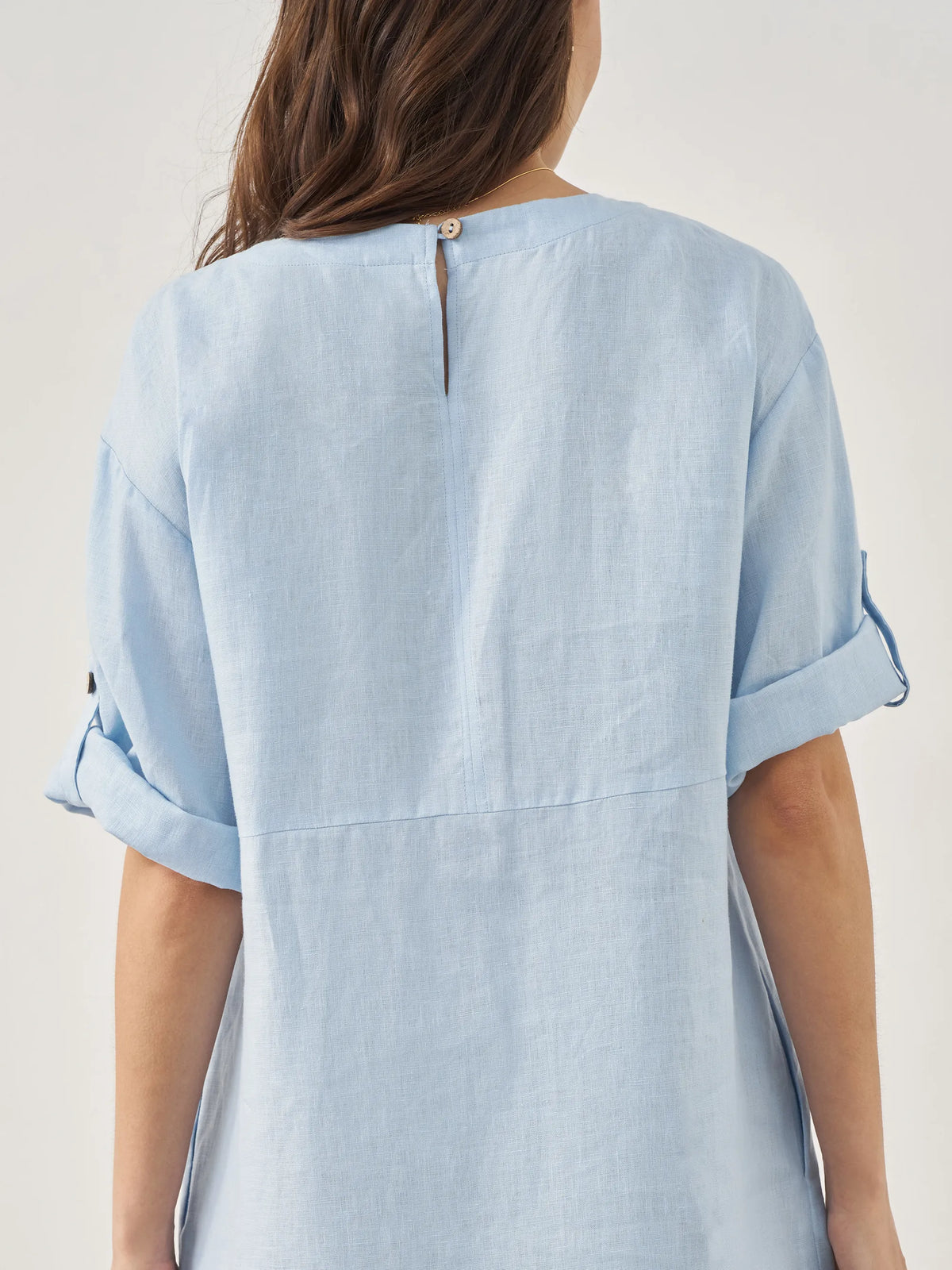 a woman wearing a blue shirt