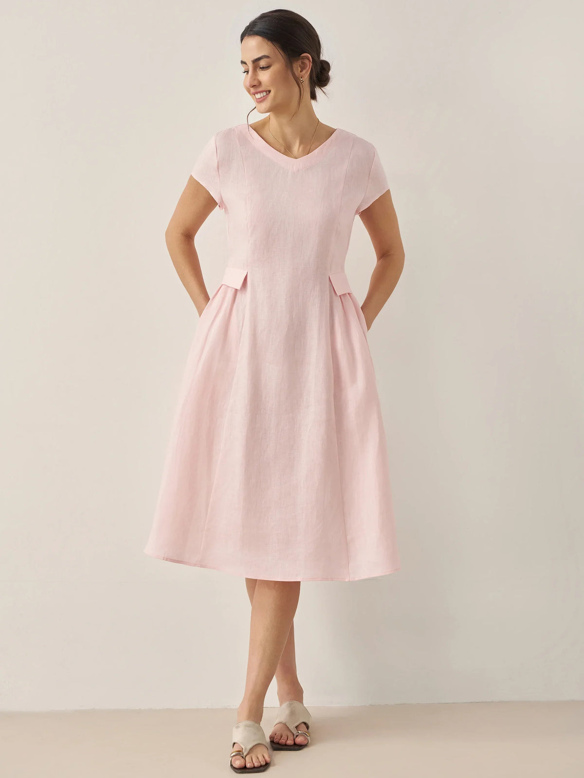 a woman in a pink dress