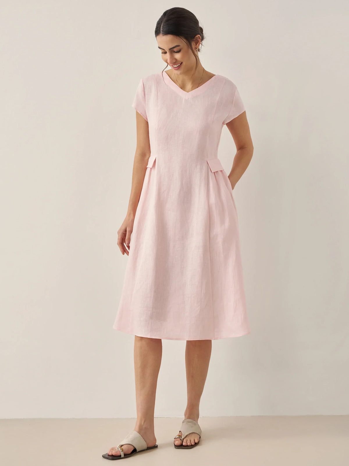 a woman in a pink dress