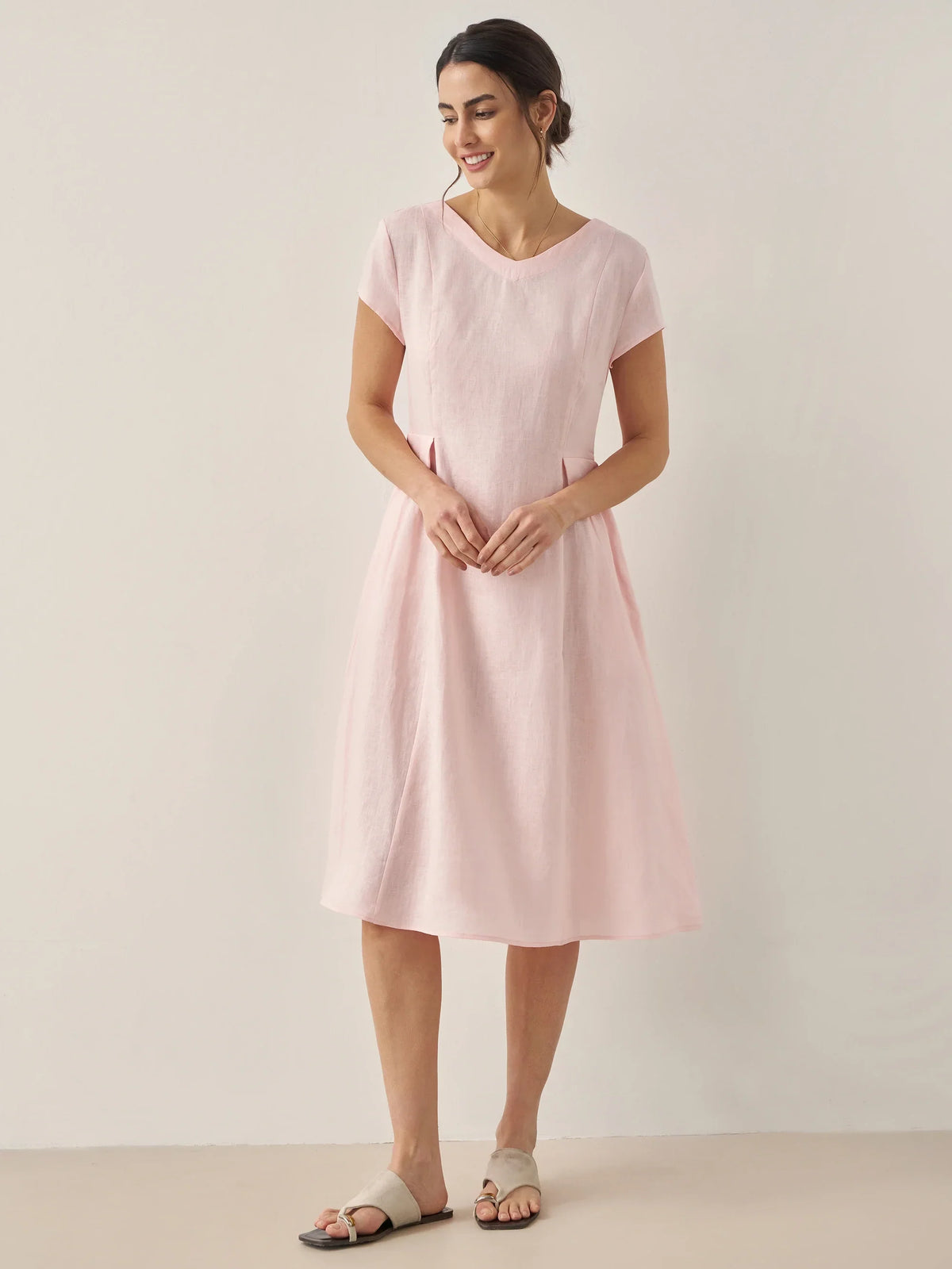 a woman in a pink dress