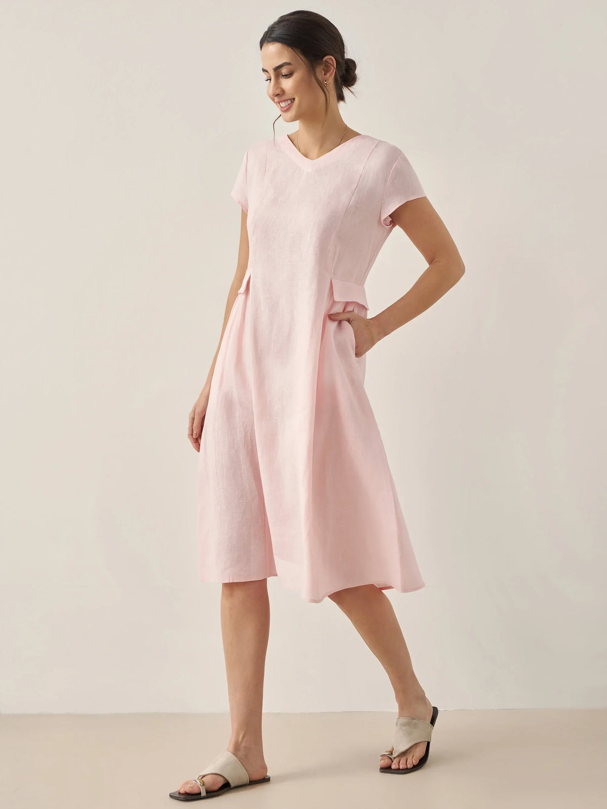 a woman in a pink dress