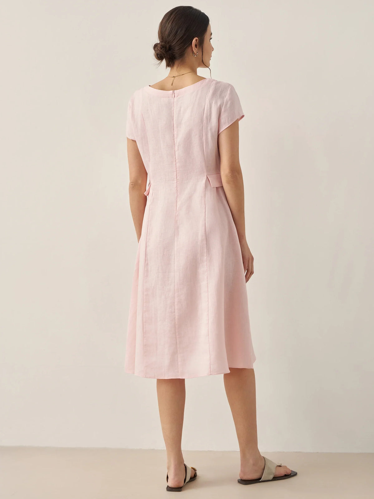 a woman in a pink dress