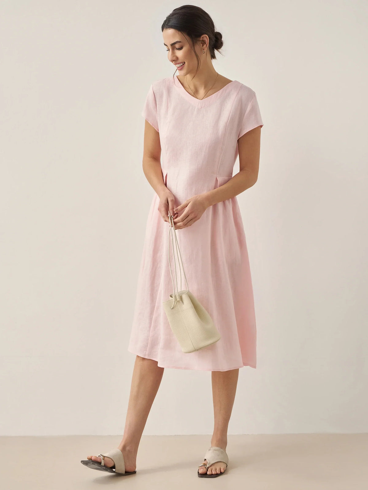 a woman in a pink dress