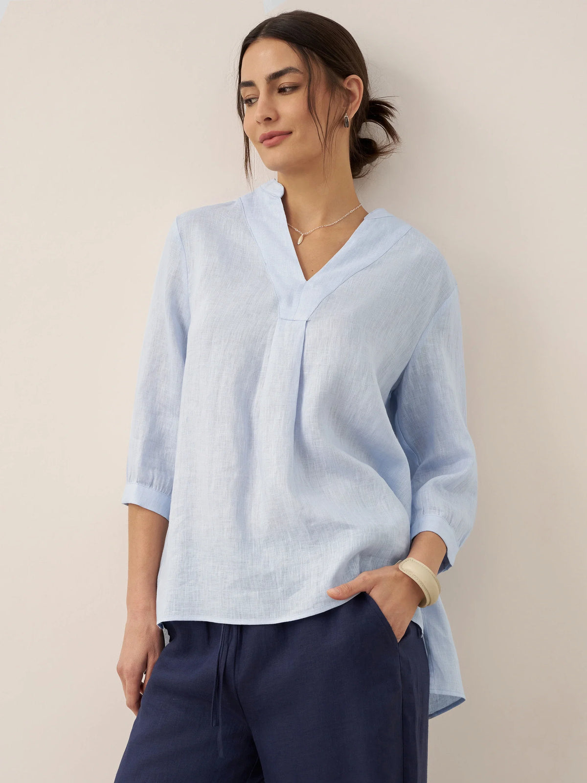 a woman in a blue shirt