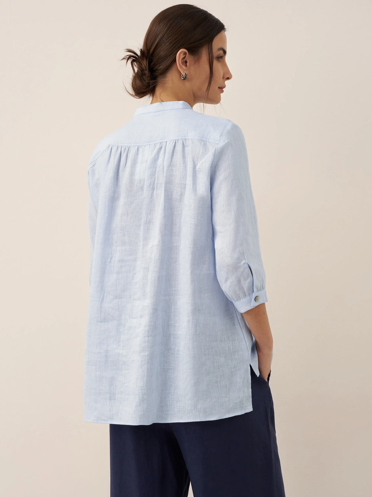 a woman in a blue shirt