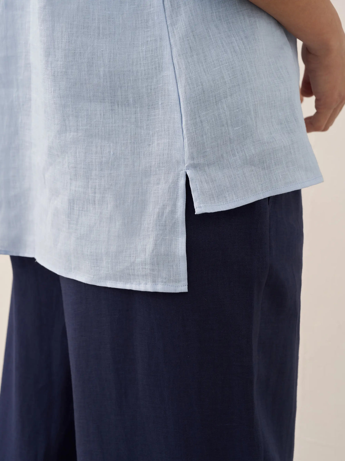 a person wearing a blue and white shirt
