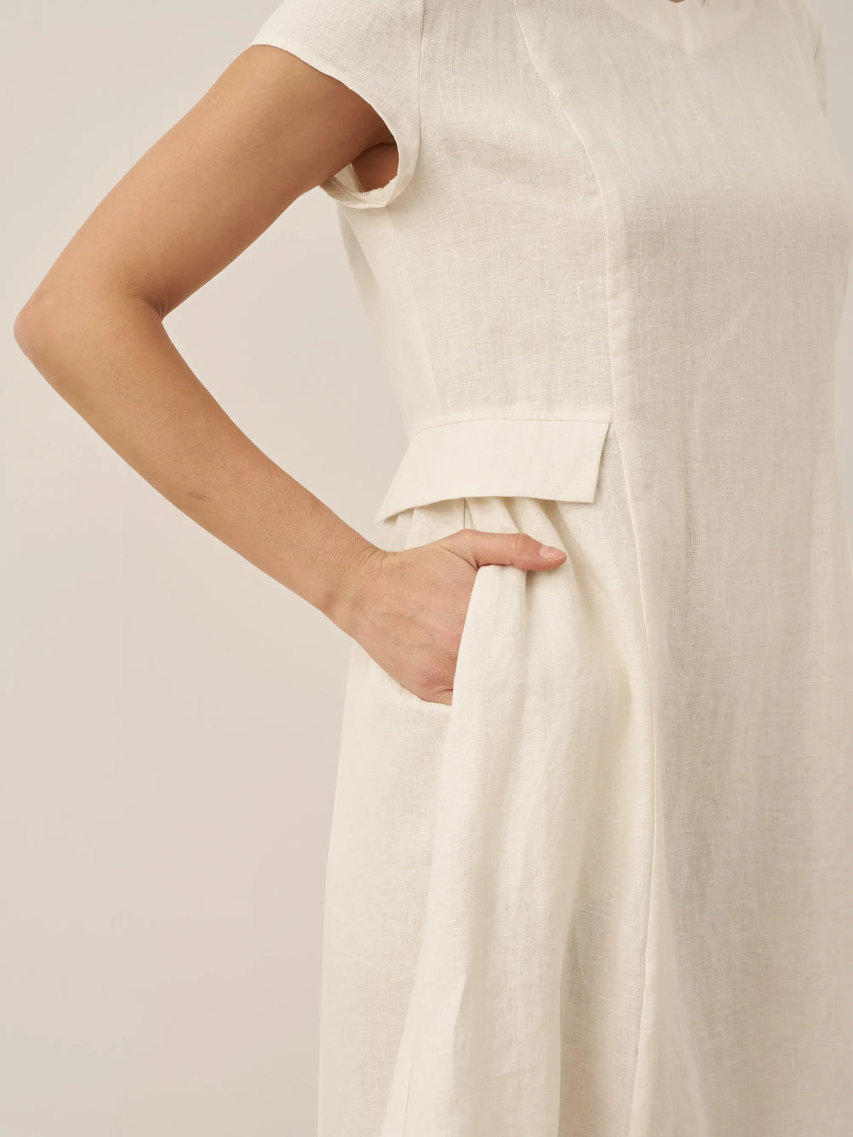 a woman wearing a white dress