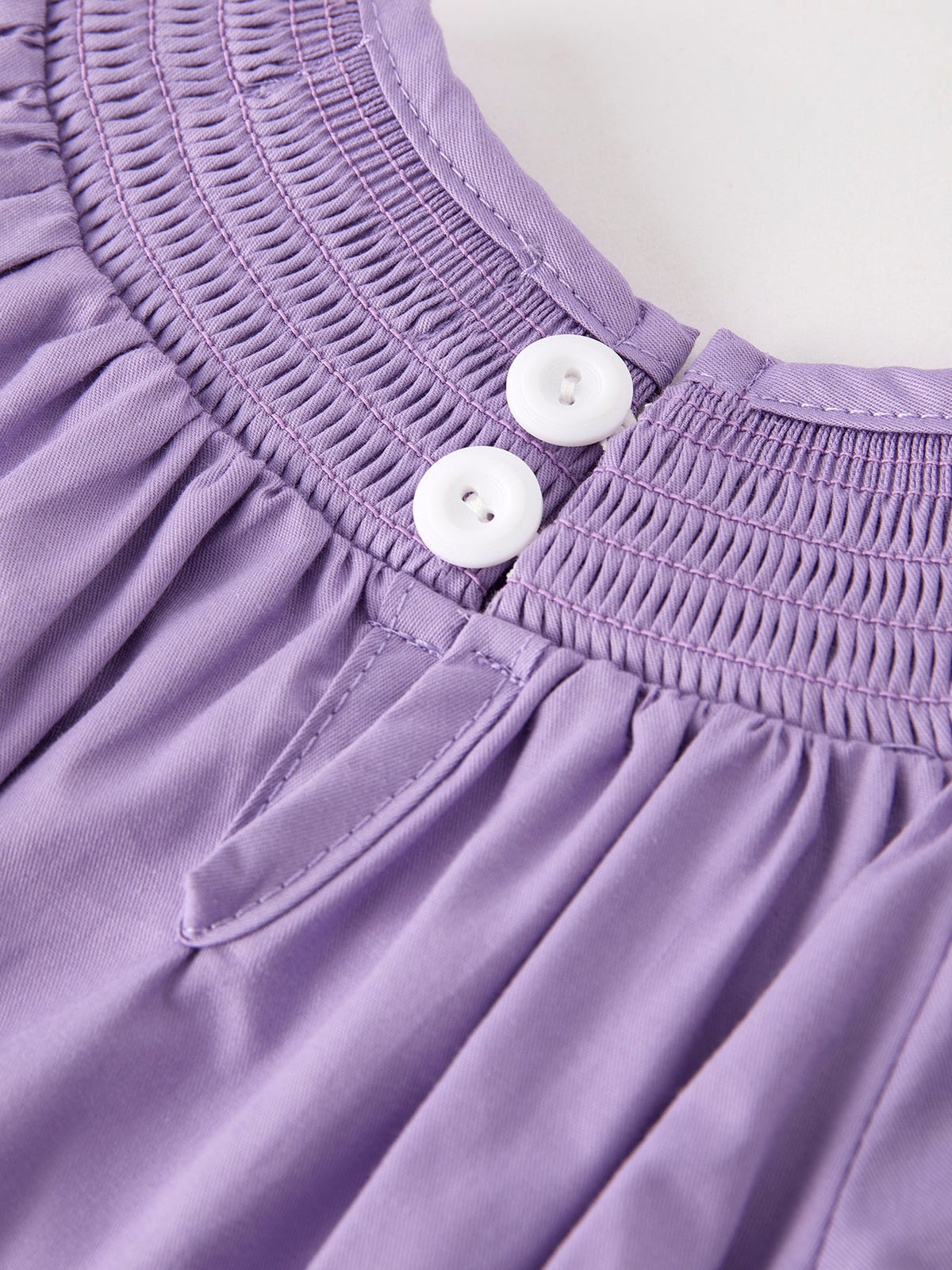 a close up of a purple dress