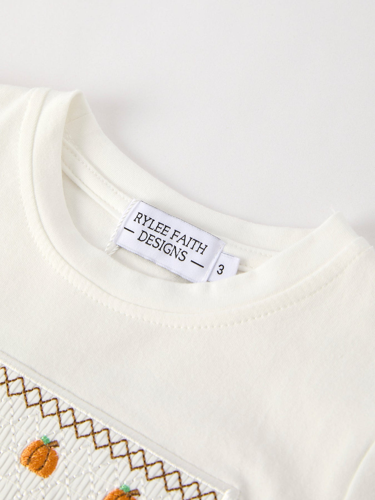 a white shirt with a label on it
