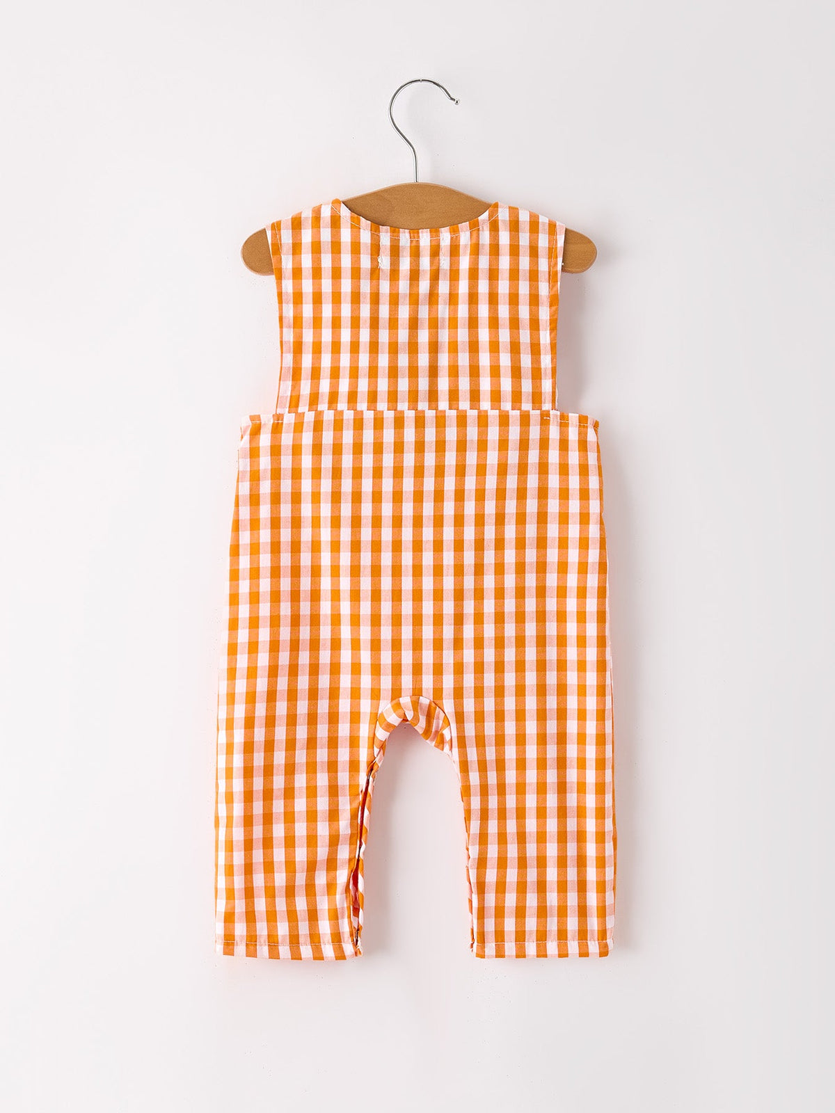 a baby romper on a swinger