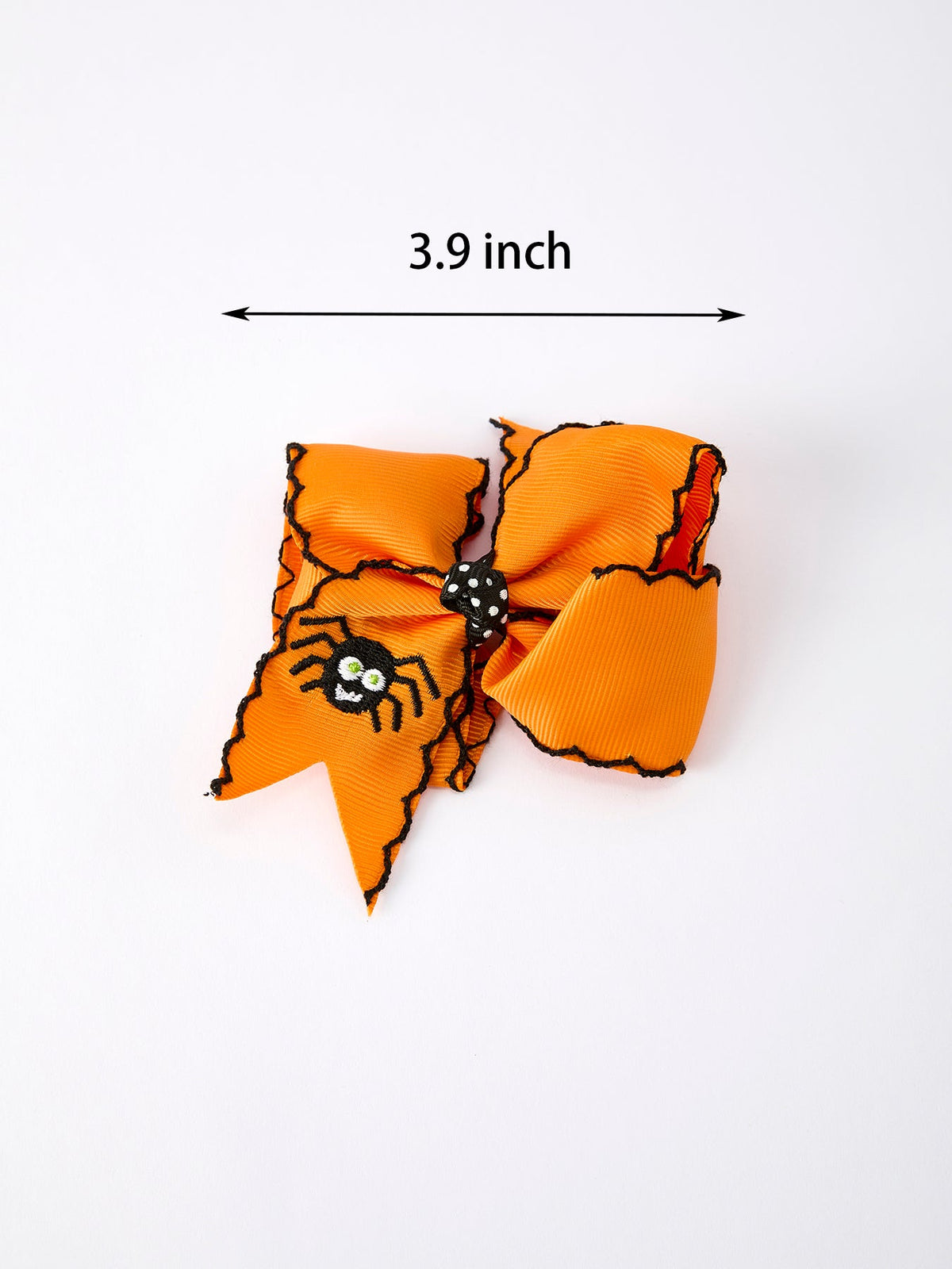 a orange bow with a spider on it