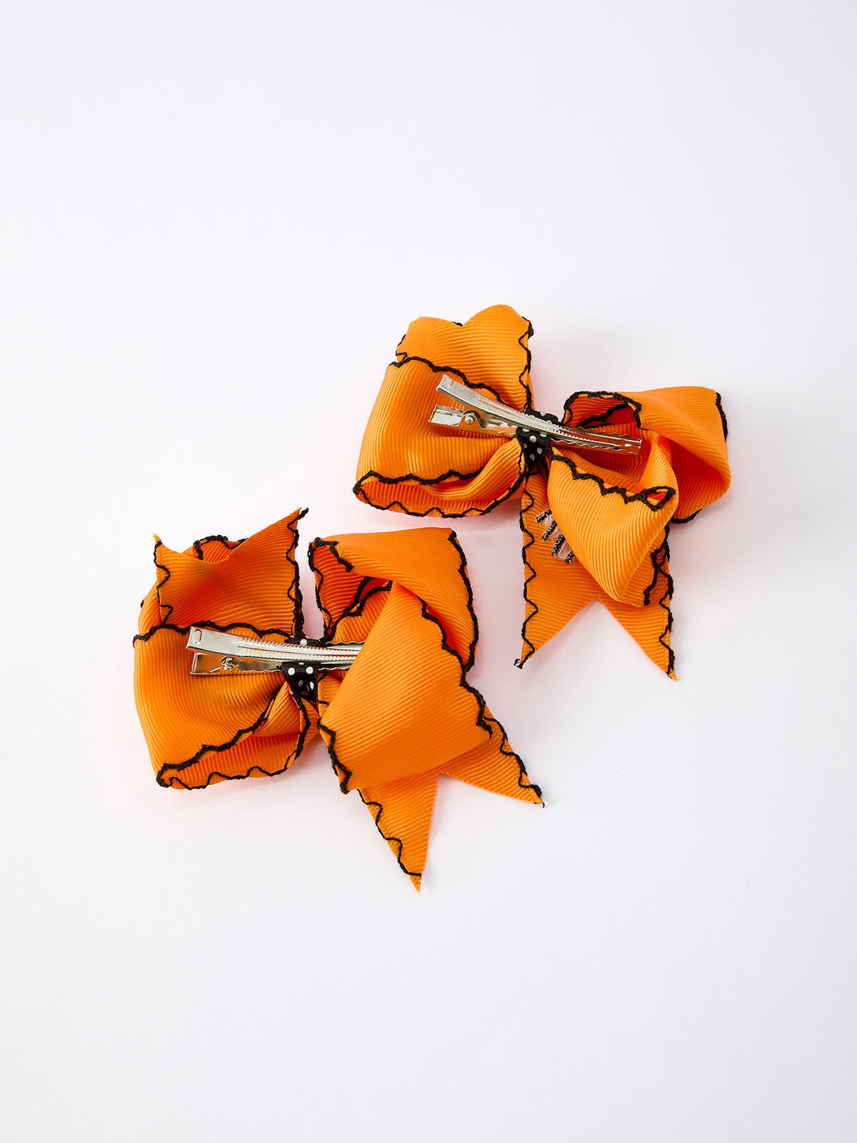 a pair of orange bows